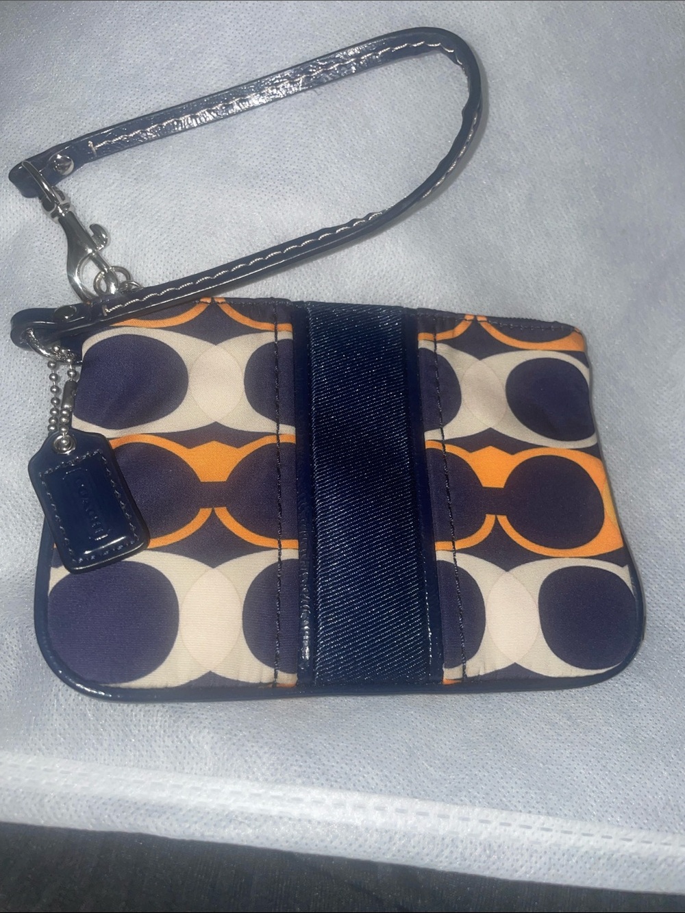 Coach Signature Circle Print Wristlet in Navy, Orange & Cream